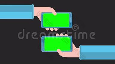手里拿着绿色屏幕的智能手机